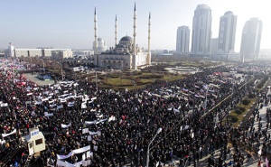 People attend a rally to protest against satirical cartoons of prophet Mohammad, in Grozny, Chechnya